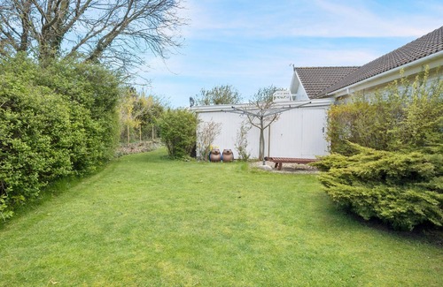 Follenslev House | Relax with your family in this bright and beautiful vacation home with a private garden.