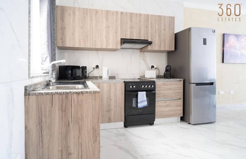 Tarxien Apartment | Relaxed 2BR Home with Backyard & Balconies,Tarxien