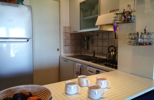 Golfo di Marinella Apartment | Relaxing beachfront apartment with spacious veranda, pool, a/c, parking