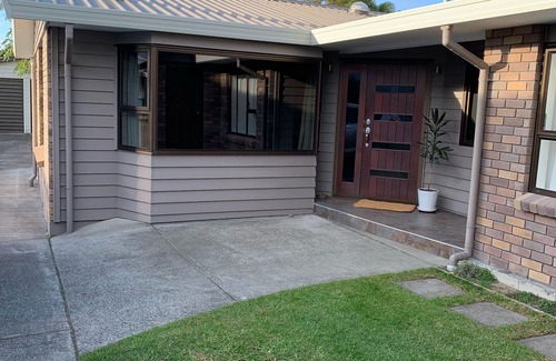 Papamoa Beach House | Relaxing Haven For Families With Spa - minutes walk to the beach, shops & dining