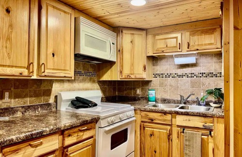 Manitou Beach House | Remodeled cozy retreat with a lake front view on Devils Lake. Pet Friendly!