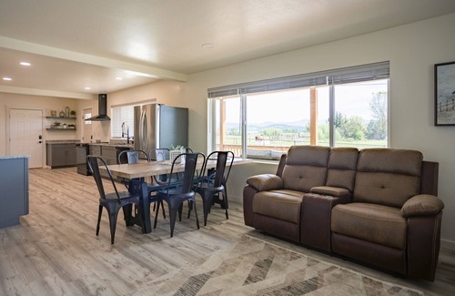 Eagle Point House | Remodeled 3 BR/2.5 BA Retreat near Eagle Point. Includes main house and a private cottage. Group-friendly kitchen, famous waffle bar, hot tub, and electric fireplace. Great space for cooking and connecting.