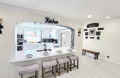 Royal Palm Beach House | Remodeled cozy family house with heated pool, 10 min from the airport!