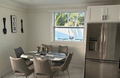 Royal Palm Beach House | Remodeled cozy family house with heated pool, 10 min from the airport!