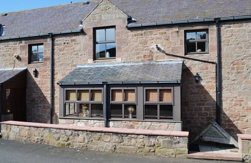 Belford Cottage | Renovated cart shed with enclosed gardens and views towards Holy Island.