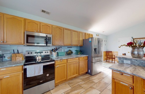 Wind Over Waves House | Renovated water-view house with private pool, hot tub, game room, & central AC