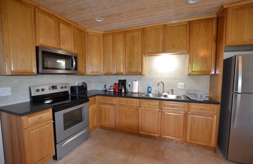 Spanish Wells House | Rental Cottage with DOCK on the canal in Pelican Bay