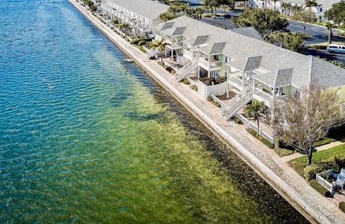 Coquina Key Condo | Resort style Luxury condo on the waterfront with private patio overlooking bay.