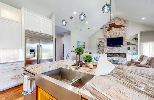 Waller House | Resort-Style Oasis with Swimming Pond, Beach, Tropical Hut & Bar