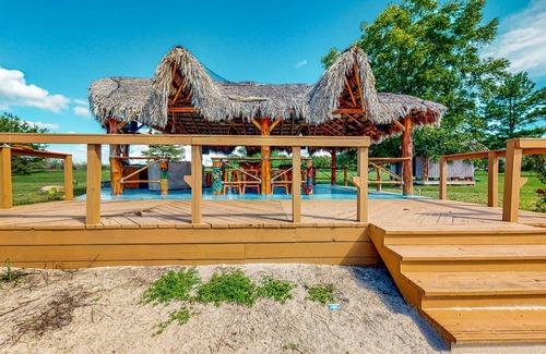 Waller House | Resort-Style Oasis with Swimming Pond, Beach, Tropical Hut & Bar