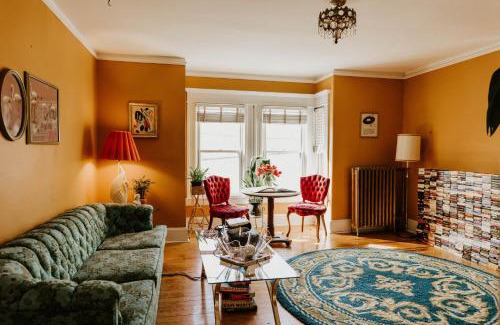 West Seventh Apartment | Retro Gem Box Victorian Steps from Irvine Park