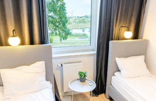 Ilawa Apartment | River View - widok na wodę, parking w hali, winda, 3pok i 5 łóżek, klima, Netflix i Max, centrum