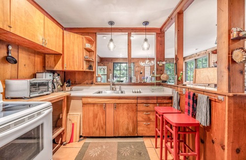 Hacienda House | Riverfront, dog-friendly home with private hot tub, fireplaces & amazing decks