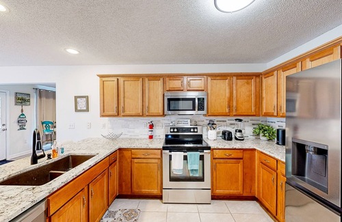 River Trace House | Riverfront home near Gulf beaches with private deck & scenic dock