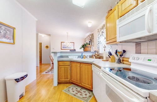 Sparta House | Riverfront home with a large yard, fireplace, deck, & washer/dryer