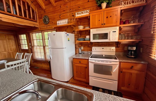 Choestoe Cabin | Riverfront Log Cabin with Hot Tub-Tubing on the River, Pet Friendly.