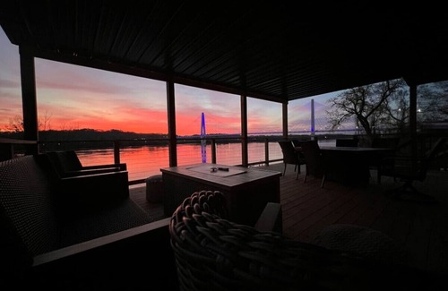 Russell Condo | RiverSuite1 - A mesmerizing river & bridge view.