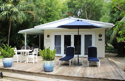 Islamorada House | Romantic Garden View Studio Cottage Nestled in Lush Landscaping with Pool and Dockage located on .