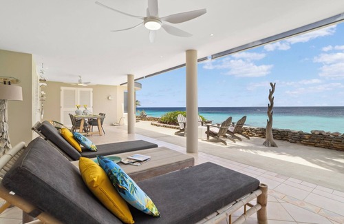 Belnem House | Romantic oceanfront studio in Bonaire with private porch and sea views. Perfect for couples seeking peace, privacy, and tropical charm.