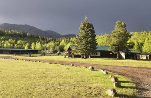 Buckinghorse River Cabin | Room 2 at the Main Lodge with a queen bed and single bed.