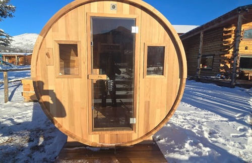 Buckinghorse River Cabin | Room 4 at the Main Lodge with a queen bed and single bed.