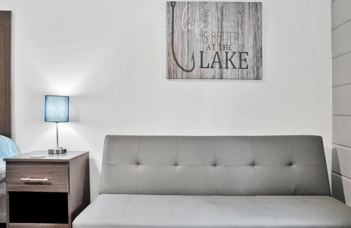 Houghton Lake Hotel | Room #4: Updated King Suite w/small couch