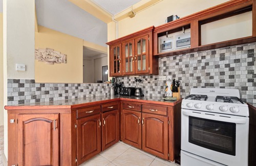 Morne Rouge Apartment | Roomy [1,001 sq ft] two bedroom Unit, steps away from white sand beach.