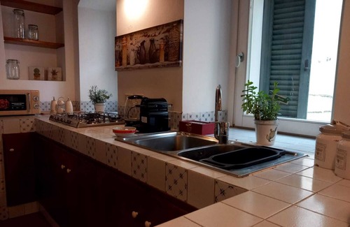 Matera Apartment | Roots - The window in the Sassi