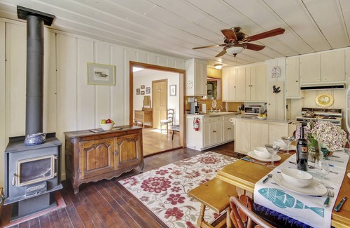 Guerneville Cabin | Roskamp ~ Riverfront Cabin with Large Yard, Seasonal River Dock & Boats
