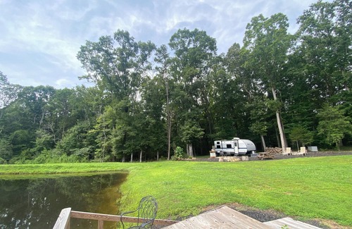 Siler City RV Rental | Rural NC GLAMPING to experience off the grid camping! Privacy & pond plus more!