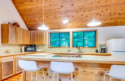 Marrowstone Cabin | Rustic cabin with wraparound deck and wood stove in a tranquil location