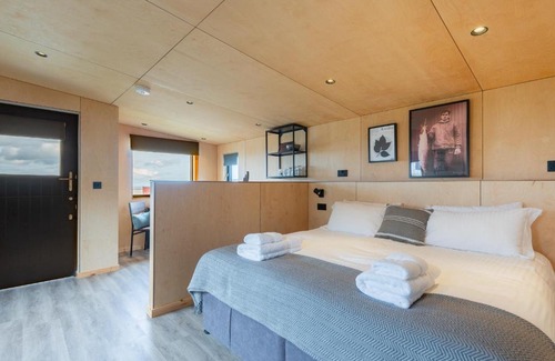 St. Andrews House | Rustic Cabins, sea views from rewilded farm with Highland Cows