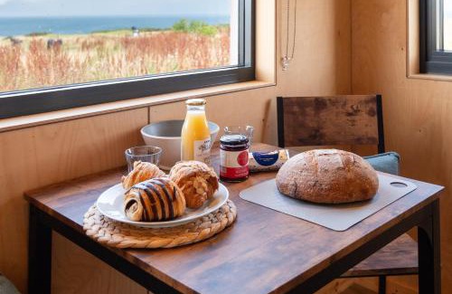 St. Andrews House | Rustic Cabins, sea views from rewilded farm with Highland Cows