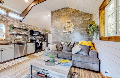 Evergreen House | Rustic getaway with fireplace, patio area, board games, full kitchen, & TV