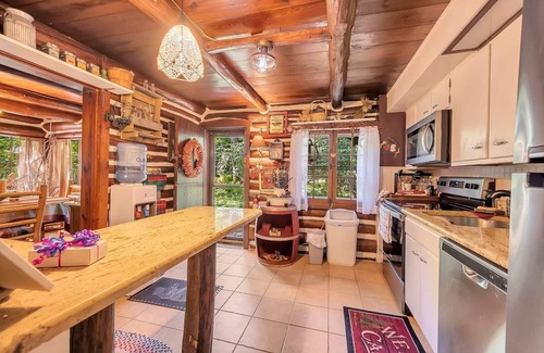 East Stroudsburg Cabin | Rustic Rest Log Cabin, with hot tub and trout stream, near Poconos attractions.
