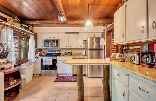 East Stroudsburg Cabin | Rustic Rest Log Cabin, with hot tub and trout stream, near Poconos attractions.