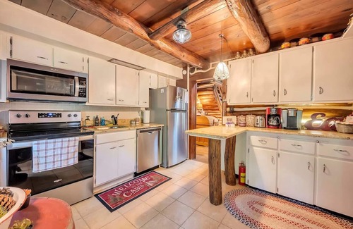 East Stroudsburg Cabin | Rustic Rest Log Cabin, with hot tub and trout stream, near Poconos attractions.