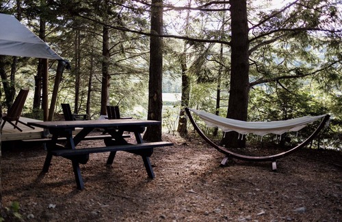 Thornton RV Rental | Safari Tent Site 6 | 1 Queen Bed & 1 Twin Bed | Pond View