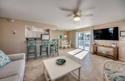 South Island House | Sand Dollar #4 - Upstairs Apt with shared Pool on Canal by the Beach!