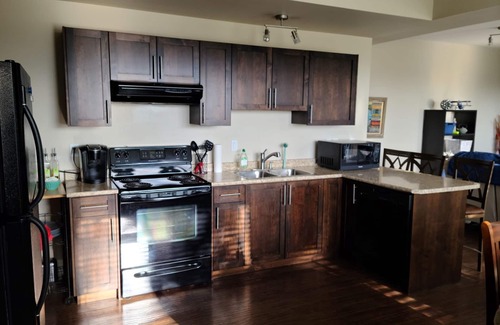 McMillan Apartment | Scenic 2 bedroom walkout suite with hot-tub and outdoor pool, across from Park.