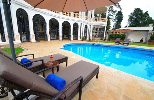 Limuru House | Scenic Escape: Elegant Room Overlooking Lush Grounds