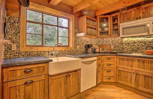 Titusville Cabin | Scenic Log Cabin with Fire Pit & Stocked Creek!