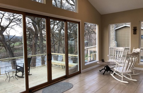 New Braunfels House | Scenic riverfront home on quiet stretch of Guadalupe - waterfall by huge front porch