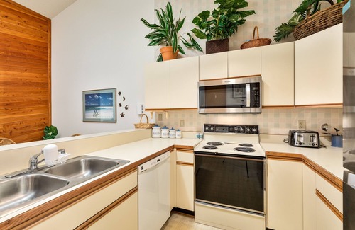 Kitty Hawk Condo | Sea Dunes condo with community pool and tennis, beach access, porch swing, baby gate, and WiFi