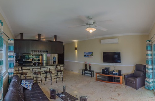 El Batey Apartment | Sea-views central condo with pool, BBQ. Guest-friendly, near sandy beach!