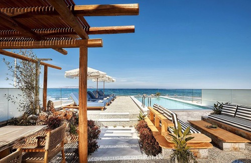 Kokkini Chani Villa | Seafront Villa with swimming pool & jacuzzi & heated pool