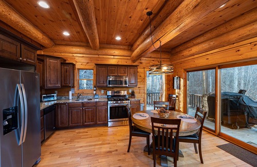 Almond Cabin | Secluded log cabin with fireplace and hot tub on deck.