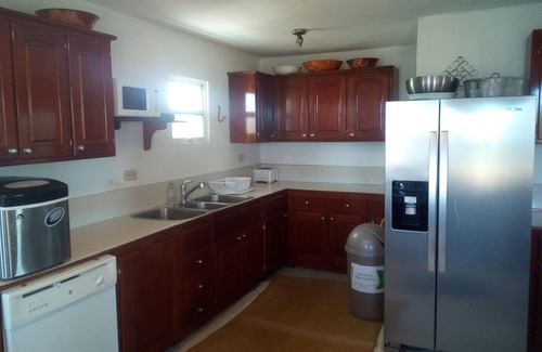 Caye Caulker House | Seculuded beachfront home, outdoor showers, rooftop deck, 360 island view