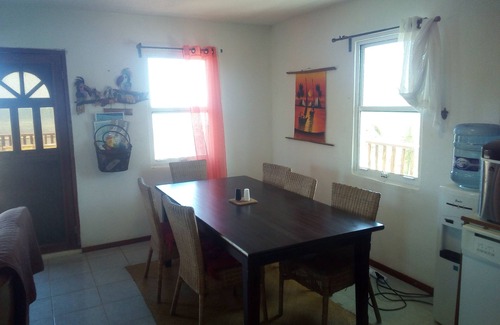 Caye Caulker House | Seculuded beachfront home, outdoor showers, rooftop deck, 360 island view