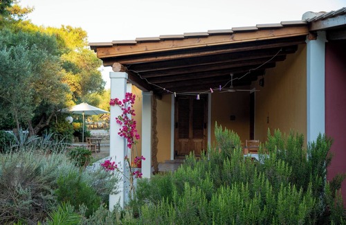 Vasilikos Cottage | Self catered cottage with large veranda and garden with hammock near the beach.